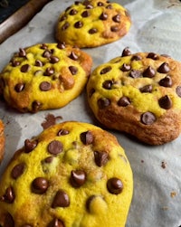 yellow chocolate chip cookies on a baking sheet