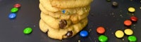 a stack of cookies with m & m's on top